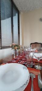 a table with a plate on top of a table at Kings Home Stay in Nakuru