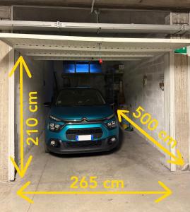 a car is parked inside of a garage at San Giovanni Apartment in San Gimignano