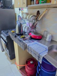 a kitchen with a stove and a counter top at Executive 1bedroom Embu by Tsparks in Embu