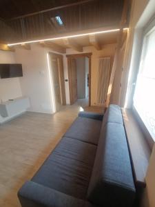 a living room with couches in the middle of a room at Coudrey 2 in Doues