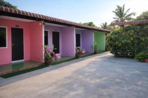 a row of houses with colorful paint at FHR Krabi City Hotel in Krabi