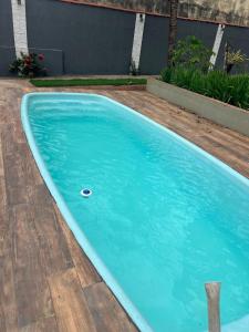 a large blue swimming pool in a yard at Your Climatized Paradise in Americana