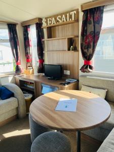 a meeting room with a table and a desk at Sea Salt in Padstow
