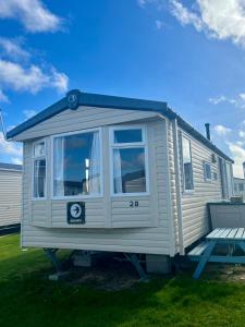 a tiny house on a trailer in a yard at Sea Salt in Padstow
