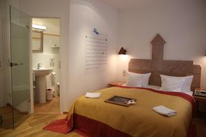 Säng eller sängar i ett rum på Hotel Drei Raben