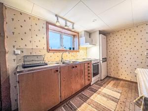 a kitchen with a sink and a window at Apartment Långerud by Interhome in Mellerud