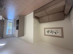 an empty room with a picture on the wall at Holiday Home Veranda-2 by Interhome in Rosapineta