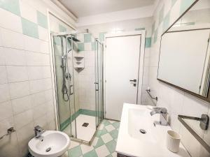a bathroom with a sink and a shower at Holiday Home Veranda-2 by Interhome in Rosapineta