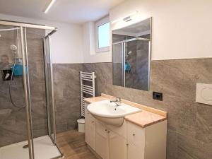 a bathroom with a sink and a shower at Apartment Cesa Cristina by Interhome in Campitello