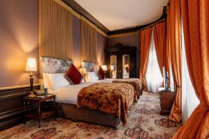 a hotel room with two beds in a bedroom at The Merchant Hotel in Belfast +42 photos