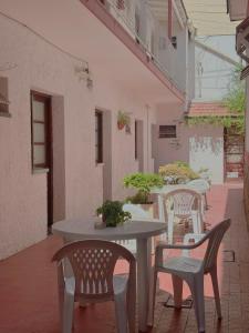 a table and chairs sitting on a patio at Lo de Sarita Hostería in Necochea