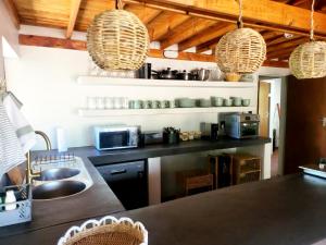a kitchen with a sink and a counter top at Mukaya Haven in Marloth Park