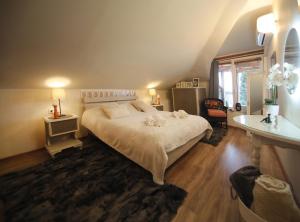 a bedroom with a large bed in a room at Lacus Orestias - unlimited view in Kastoria