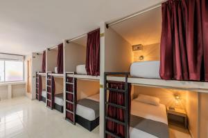 a row of bunk beds in a room at Hostel Dorado Plaza Getsemaní in Cartagena de Indias