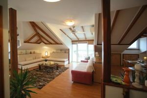 a living room with a couch and a table at Lacus Orestias - unlimited view in Kastoria