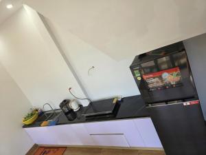 a kitchen with a counter with a stove at Đức Khoa Villa Phu Quoc in Phú Quốc