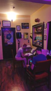two people sitting at a table in a room at Summer Beach House in Alleppey +41 photos