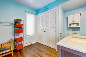 a bathroom with blue walls and a sink at Chautauqua Lake Views! Bemus Point Getaway in Bemus Point +21 photos