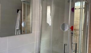 a shower with a glass door in a bathroom at Casa Bueu Pontevedra in Bueu +30 photos
