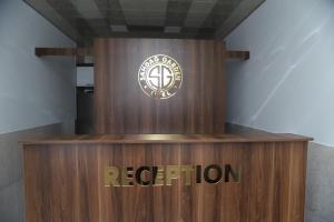 a brown podium with aoren logo on it at Qusar Shahdag Garden Hotel in Qusar +34 photos