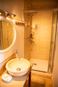 a bathroom with a sink and a shower at Le Vieux Castel in Roumoules +36 photos