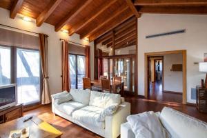a living room with a white couch and a table at Catalunya Casas A Costa Brava gem - only a few minutes to the beach! in Vidreres