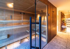 a sauna with a bench inside of a building at The Zipper Hotel und Apartments in Düsseldorf