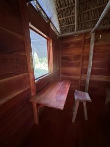 a wooden bench in a room with a window at Writer's Cabin in Santa Cruz