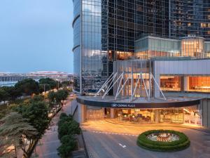 a view of a building with a street in front at Crowne Plaza Macau by IHG in Macau