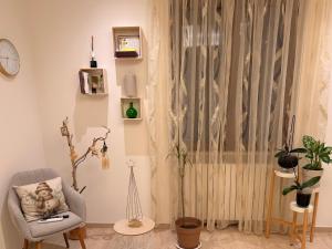 a living room with a chair and a window at DalGra room e garden in Torrevecchia Teatina +52 photos