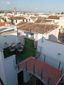 a view from the balcony of a white building with a patio at Corredera Travel 5 in Córdoba