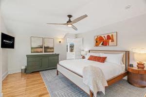 a bedroom with a bed and a ceiling fan at Featherstone in White Bear Lake