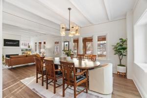 a dining room with a table and chairs at Featherstone in White Bear Lake