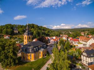 an aerial view of a small town with a church at Pension Zum Schotten in Zella-Mehlis