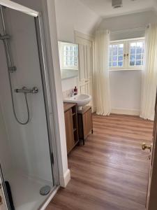 a bathroom with a shower and a sink at St Giles Lodge in Inverness +31 photos