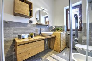 a bathroom with a sink and a mirror at Anima Alpina in Morgex +18 photos