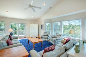 a living room with couches and a table at 3215 - Papa Duck in Duck