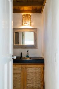 a bathroom with a sink and a mirror at NEW MORINGA in Las Terrenas +123 photos