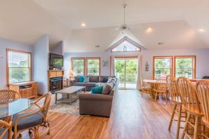 a living room with a couch and a table at 3944 - Carolina Escape in Duck