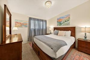 a bedroom with a bed and a dresser and a window at Red Ivy #5 in Boise