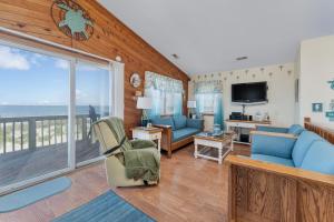 a living room with a view of the ocean at 4785 - Paradise Found in Kitty Hawk