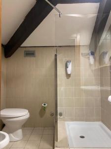 a bathroom with a shower and a toilet at Hotel Center 2 in Rome +56 photos