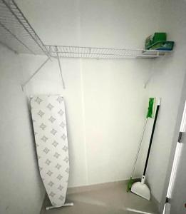 a room with a white wall with a shelf at Studio apartment- private entry! in Homestead +17 photos