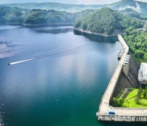 an aerial view of a river with a bridge at Róża Wiatrów in Solina