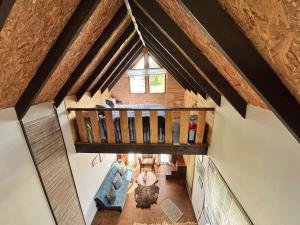 an overhead view of a house with a wooden ceiling at Tiny House, Tiny Black Frutillar in Frutillar