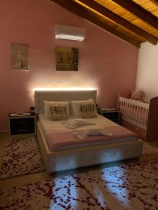a bedroom with a bed and two night stands at CASTLE View SERENITY -- BERAT in Berat