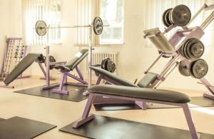 a gym with several different types of machines at Hotel Hrádok in Jelšava