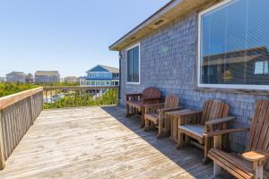 a deck with three chairs and a window at 7504 - Sunrise-Sunset in Avon +27 photos