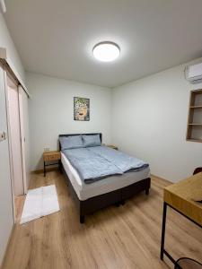 a bedroom with a bed in a room at Boutique Rooms Desi 2 in Pleven