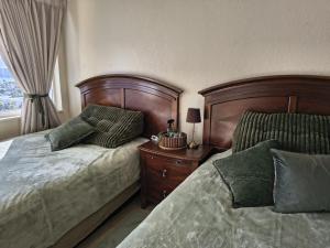 a bedroom with two beds next to a window at Condo-Hotel on Collins ave in Sunny Isles Beach +10 photos